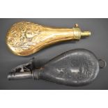 Copper and brass powder flask together with a leather shot flask, both with embossed decoration to