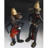 Two modern metal figures of dogs as firefighters one with a bucket (H71cm) the other with a fire