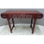 Carved oriental hardwood altar-table with rolled ends,  W127 x D43 x H83cm