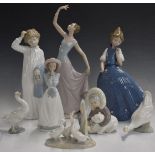 Eight Lladro and Nao figures, tallest 35cm