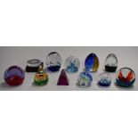 Eleven Caithness and similar glass paperweights including Buccaneer, Abseil and Quicksilver, some