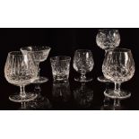 A collection of clear cut crystal drinking glasses including six Waterford brandy glasses, a set