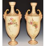 Pair of Royal Worcester blush ivory pedestal vases with twin mask handles, H27cm