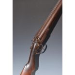 L C Smith 12 bore side by side hammer action shotgun with named locks, chequered semi-pistol grip