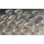 Eighteen vintage jelly moulds, tallest 15cm