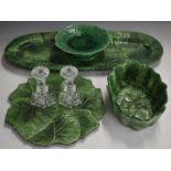 A collection of majolica ware including a large oval dish and a pair of Waterford candlesticks,