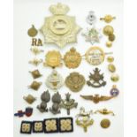 Small collection of badges including Royal Artillery, Royal Guernsey Regiment, Officers' Training