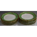 Sixteen Spode Felspar dinner plates with gilded decoration on a green ground, diameter 25cm