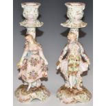 Pair of Continental porcelain figural candlesticks, H19.5cm