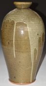 Large studio pottery drip glazed baluster vase with incised footed star mark to base, H43cm
