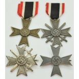 Four German WW2 Third Reich Nazi War Merit Cross medals, two with crossed swords, one stamped 3 to