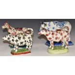 Three 18th/19thC Spongeware cow creamers and an 18thC Delft cow with milkmaid, signed Jacobus Holder