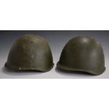 Two Russian steel helmets, one stamped 268511, the other 213122, both with liner and chinstrap