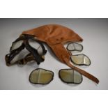 Pair of WW2 Mark IV flying goggles together with various extra lenses and a flying hat with label