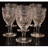 A set of six 19thC clear glass wine glasses with engraved decoration of birds, flowers and