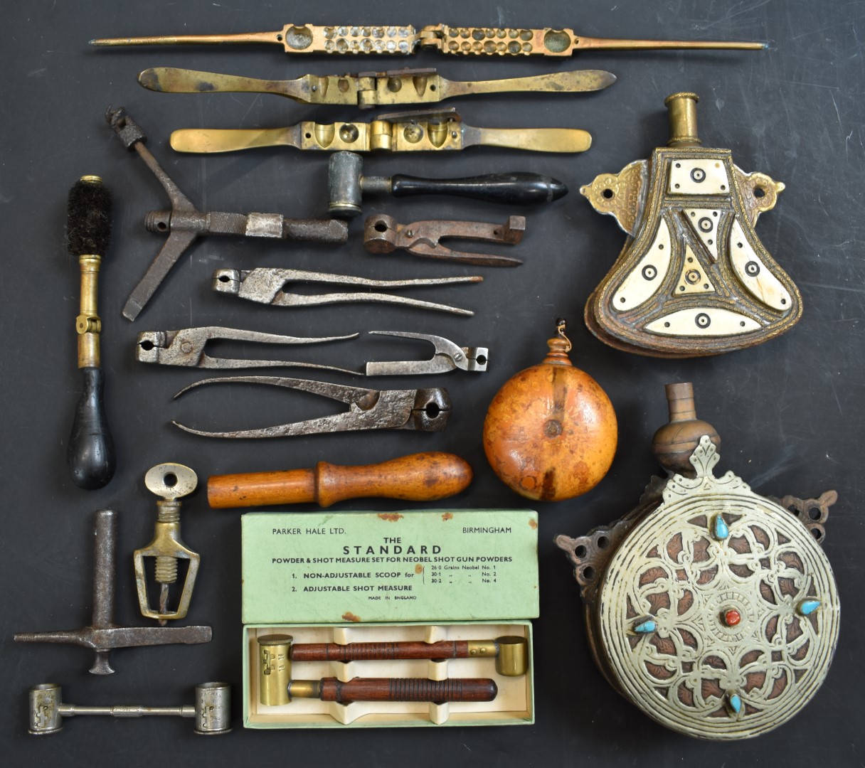 A collection of shooting related items including a pair of Parker-Hale powder measures in original