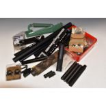 A collection of gun parts and accessories including air rifle sound moderators, Parker-Hale target
