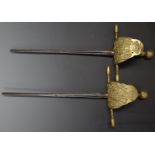 Pair of continental court/short swords with leather grips, leather backed guards and both with