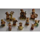 Ten Hummel Goebel figures including 'Signs of Spring', 'Monkey Business' and 'Love Petals'