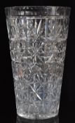A large cut glass vase with star cut base, 36cm tall.
