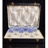A set of six blue overlay cut glass liqueur glasses with octagonal stems and star cut bases, 14.