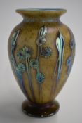 Okra glass vase with iridescent stylised flowers, signed to base Okra 2002, 17cm tall.