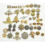 Collection of British Forces badges and buttons together with some civilian examples, including bi