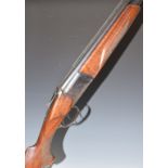 Baikal 12 bore over and under ejector shotgun with engraved scenes of deer to the locks, engraved