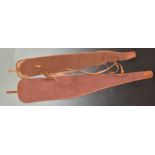 Two Brady of Halesowen canvas and leather shotgun or rifle slips.