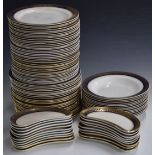 Approximately 95 pieces of Wedgwood and Co dinnerware decorated with a cobalt blue and gilt