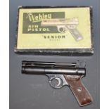 Webley Senior .177 air pistol with named and chequered Bakelite grips, in box with targets