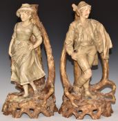 A pair of Royal Dux male and female figural candlesticks, shape 1374, H34cm