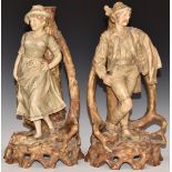 A pair of Royal Dux male and female figural candlesticks, shape 1374, H34cm