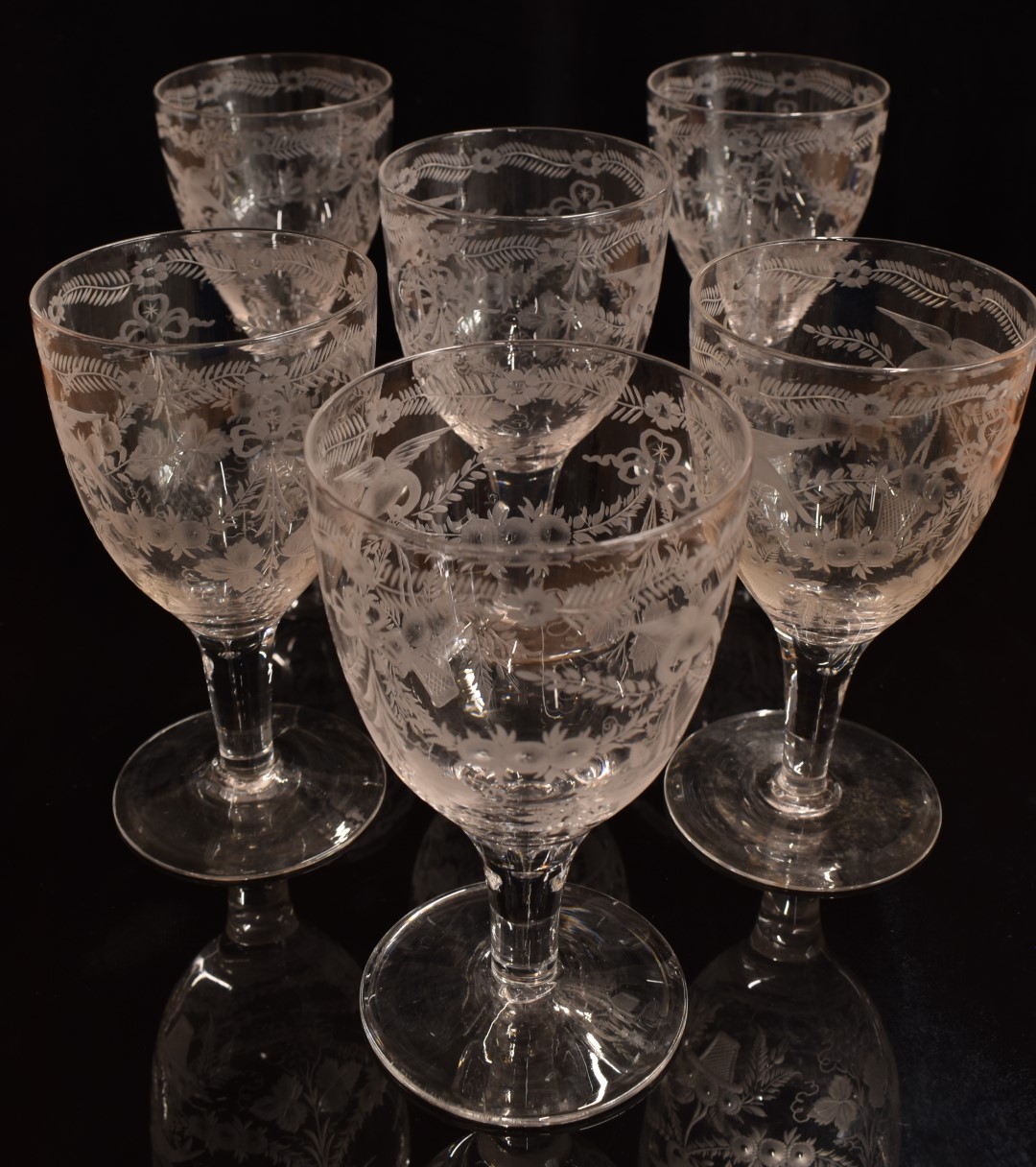 A set of six 19thC clear glass wine glasses with engraved decoration of birds, flowers and - Image 2 of 2