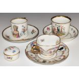 Three Meissen cups and saucers and covered trinket pot variously decorated with Watteau scenes,
