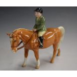 Beswick boy on palomino pony, H15cm