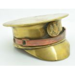 WW2 trench art officer's cap made from a brass shell, with copper chin strap and button badge,