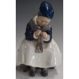 Copenhagen figure of a girl sewing, marked 1314 and 173 to base, H15.5cm