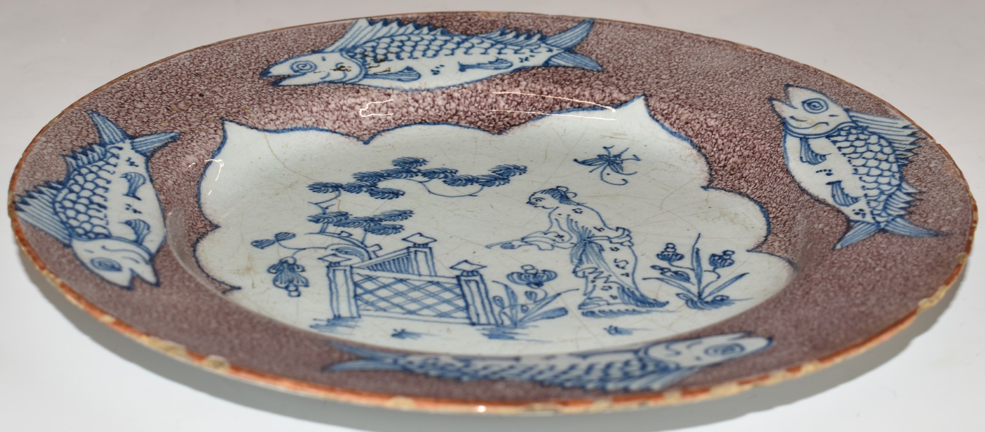 English Delft plate, London c1750, decorated with a chinoiserie garden scene within a border of four - Image 2 of 6