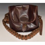 Jeffries brown leather shotgun cartridge bag together with a shotgun cartridge belt.