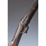 John Ilsley 12 bore single barrelled hammer action shotgun with engraving of dogs to the lock,