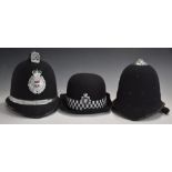 West Mercia Constabulary policeman's helmet, together with an unbadged example, both with liners and