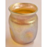 Louis Comfort Tiffany favrile glass vase in iridescent gold with dimpled sides, marked LCT to