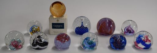 Eleven Caithness glass paperweights including Reflections, Fiesta, Starlight, Millennium Miniature