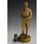 Brass figure of Adolf Hitler in uniform, with a symbolic decapitated head of himself attached to his