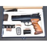 BSA .22 target air pistol with shaped wooden grips and adjustable trigger and sights, serial
