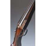 BSA 12 bore side by side shotgun with border engraved locks, hammers, underside, fences and thumb