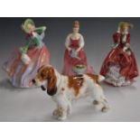Royal Doulton Spaniel HN1036 and three Royal Doulton figurines including Autumn Breezes, Alexandra