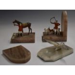 Pair of hunting interest bookends with alabaster bases and cold painted metal huntsmen with horse