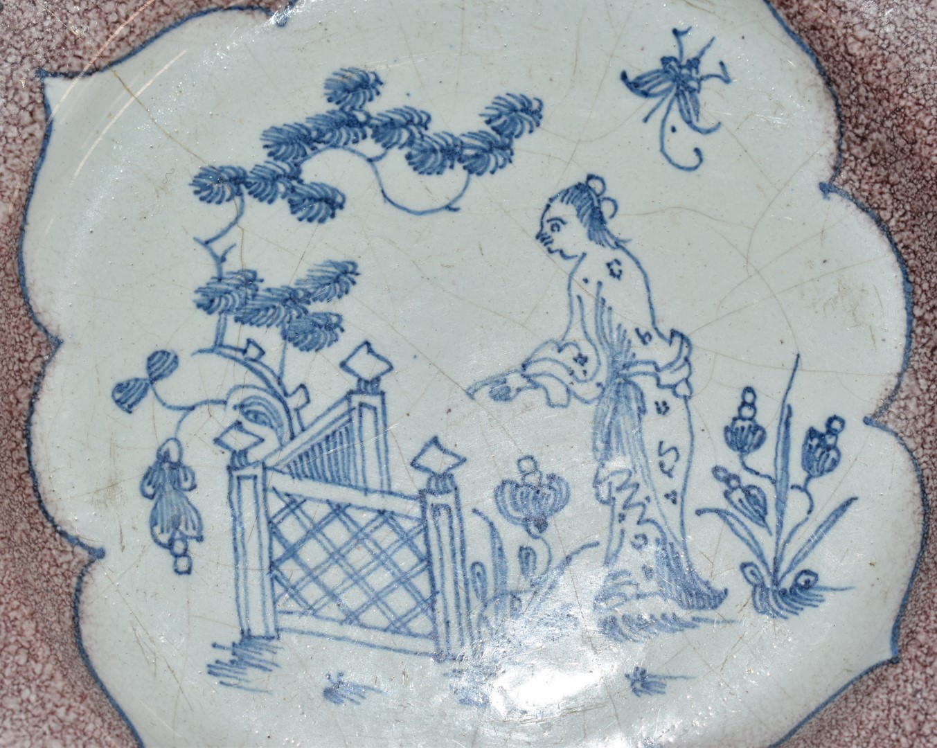 English Delft plate, London c1750, decorated with a chinoiserie garden scene within a border of four - Image 3 of 6